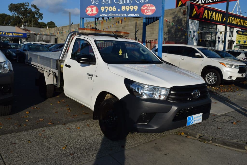 Front passenger side view of the white 2018 Toyota Hilux Workmate tipper